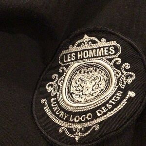 Les Hommes Black Tee with Silver Embroidered Crest Patch